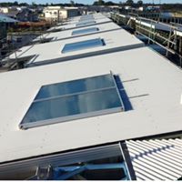 Solar hot water systems mounted on a large building in Caboolture installed by local specialists